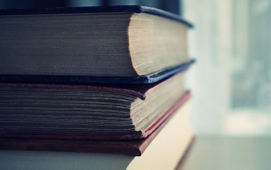 Stack of vintage hardback books