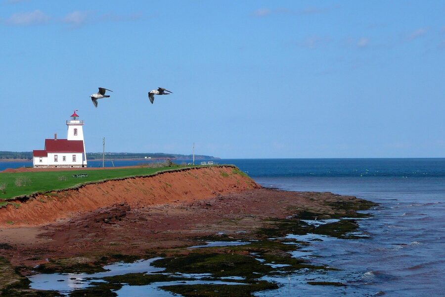 PEI lighthouse on red shoreline