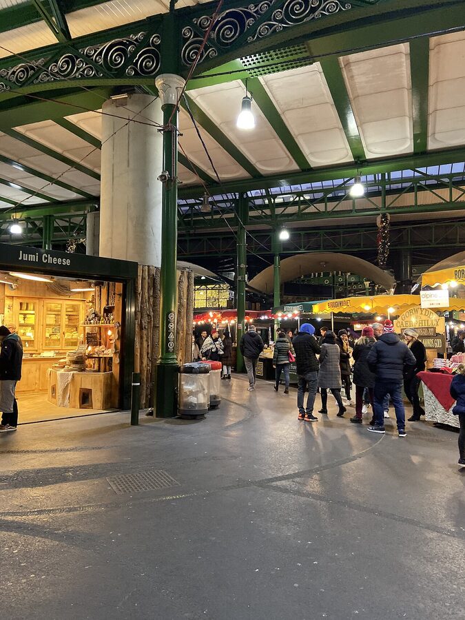 A general view of Borough Market in London with arched gates and food stalls