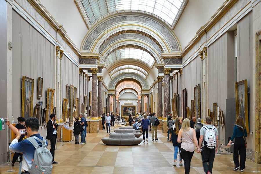 The long Grande Galerie corridor at the Louvre with paintings on both walls