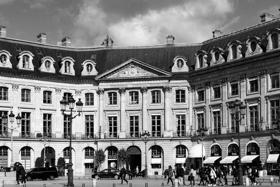 The exterior of the Ritz Paris hotel on Place Vendome with its grand entrance and awnings