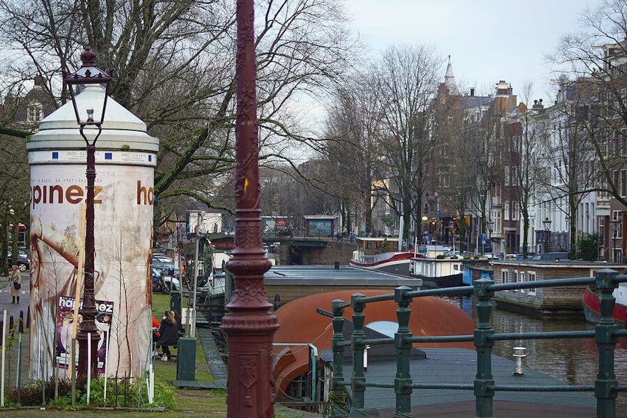 Amsterdam canal in autumn with traditional boats