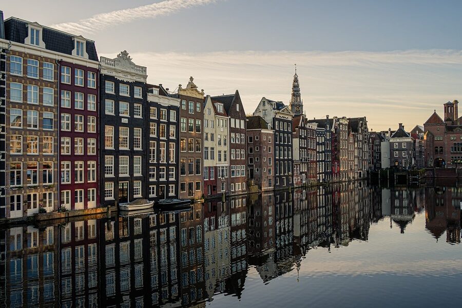 Amsterdam canal houses reflected in the water