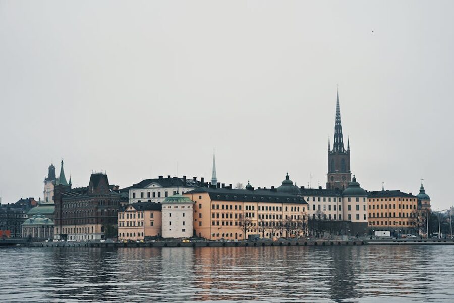 Aerial view of the colourful houses and church spires of Gamla Stan, Stockholms old town, from across the water