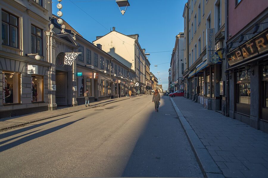 The pedestrianised section of Götgatan in Söder Stockholm with shops and small trees