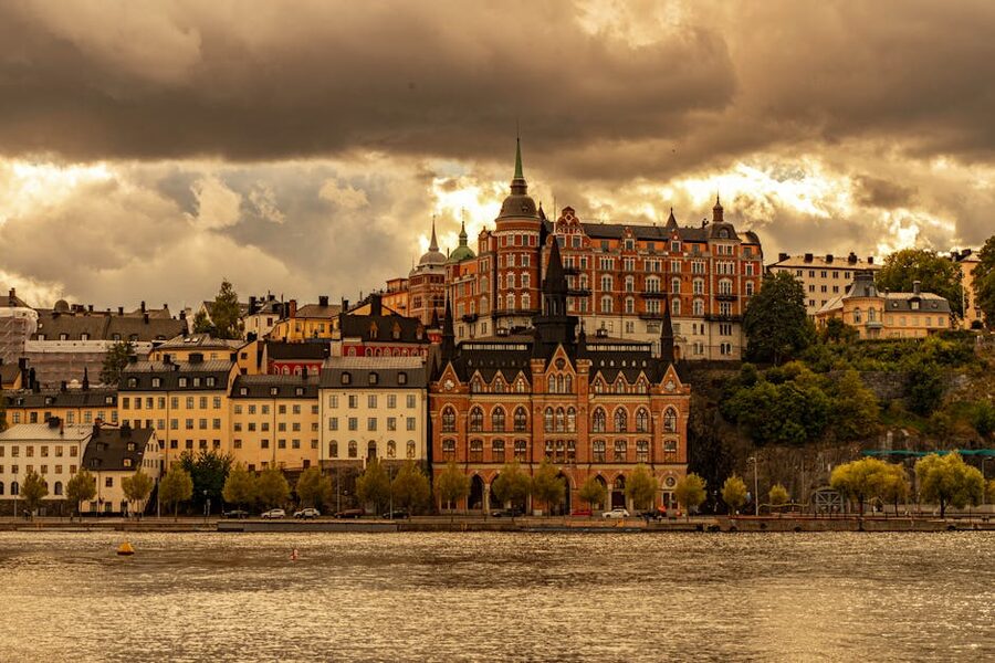 View of Mariahissen and historic buildings on the Söder shoreline of Stockholm under cloudy skies