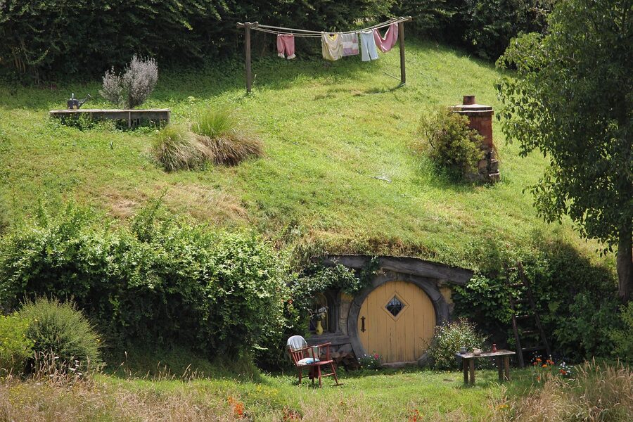 Bag End hobbit hole with bench seat at the Hobbiton movie set in Matamata