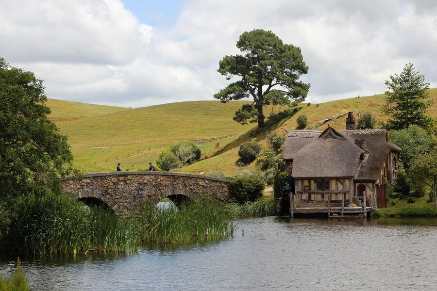Stone double-arch bridge and water mill at the Hobbiton movie set in Matamata