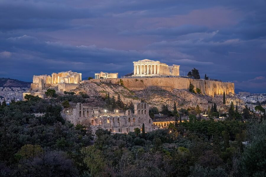 The Acropolis of Athens illuminated at night with the Parthenon and Erechtheion crowning the rock