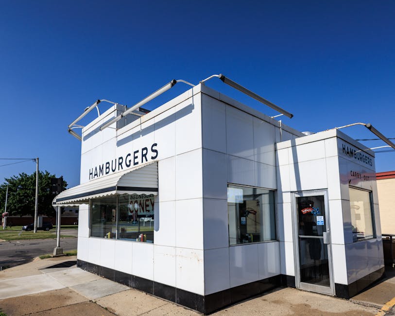Classic American diner exterior with vintage sign and clear sky