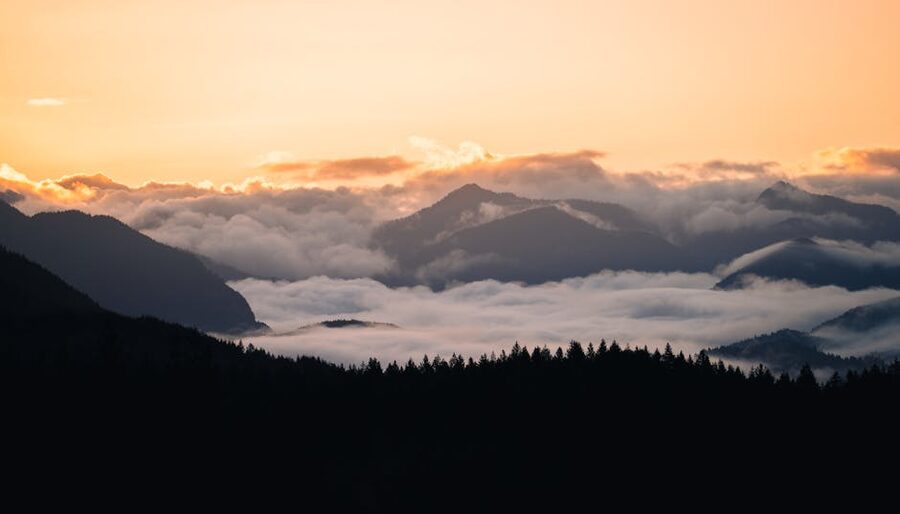 Misty mountain range at sunrise in Olympic National Park, Washington